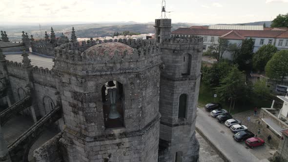 Flying over a gothic facade of Guarda Cathedral in Portugal