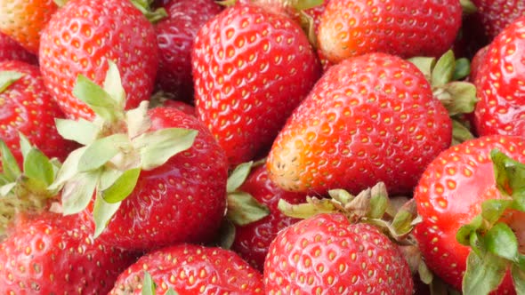 Juicy garden strawberry pile food and fruit background 4K 3840X2160 30fps UHD video - Red Fragaria a alt