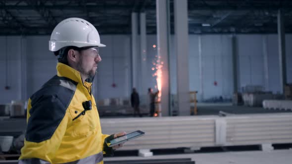 Portrait of Professional Heavy Industry Engineer / Worker Wearing Safety Uniform, 