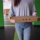 Closeup of a Box with Pizza in Female Hands - VideoHive Item for Sale