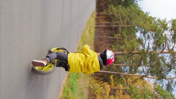 Vertical Shot of Kid Riding Balance Bike alt