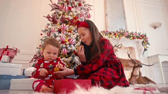 Video Portrait of Two Cute Little Children Eating Christmas Sweets alt