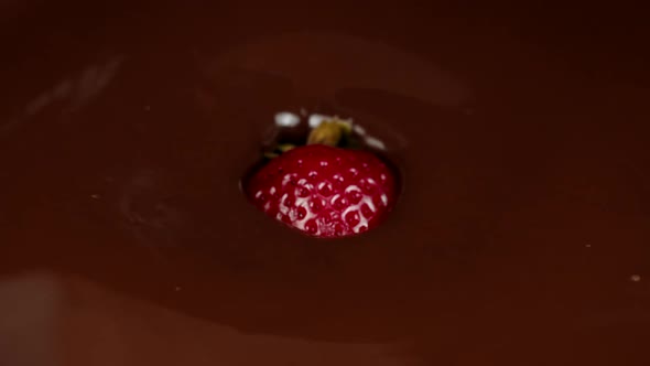 Juicy Red Strawberry Berry Falls Into Molten Premium Handmade Chocolate Slow Mo