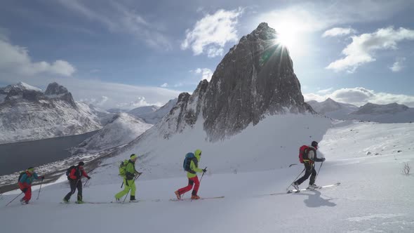 Caravan Of Skiers In The Mountains