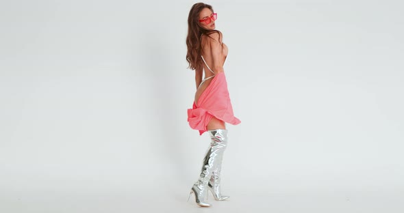 A Beautiful Girl of an Athletic Physique Erotic Moves in Front of the Camera She is Dressed in High alt