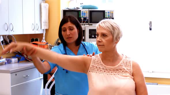 Female doctor examining a patient alt