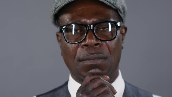Portrait of Thoughtful African Gentleman in Eyeglasses alt