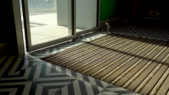 Selfsliding Doors Open to Allow Customers to Enter the Store alt