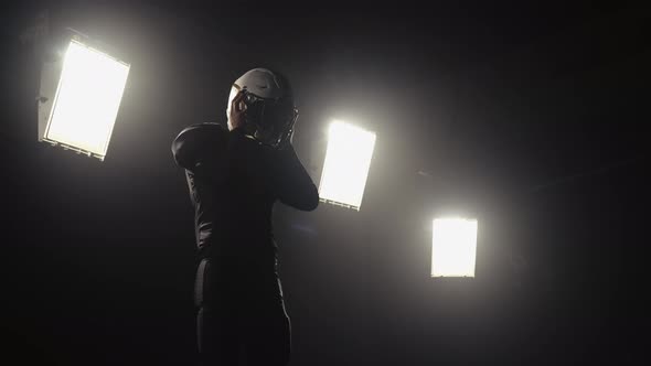 Portrait of a Bearded American Football Player Putting on Helmet and Preparing for Winning Game alt