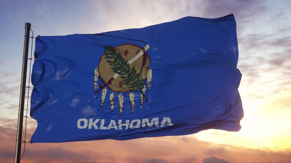 Flag of Oklahoma Waving in the Wind Against Deep Beautiful Sky at Sunset