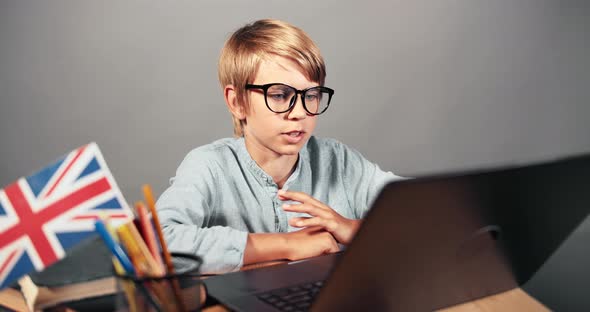 Boy Online English Lesson on Laptop