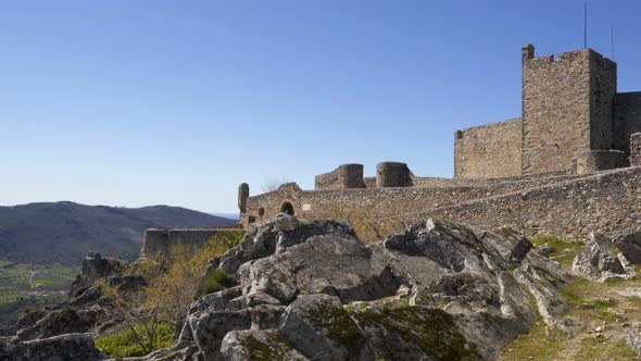 Marvao castle on the top of a mountain with beautiful green landscape behind on summer, in Portugal alt