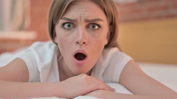 Close Up of Disappointed Creative Young Woman Feeling Shocked  alt