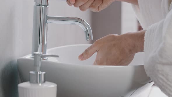 Unrecognizable Young Man in Bath Robe Closeup Male Hands Use Liquid Soap Eco Friendly Product Gel alt