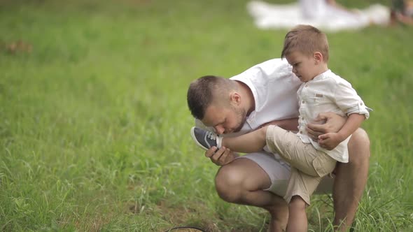 Loving Male Parent Alleviating His Son Pain