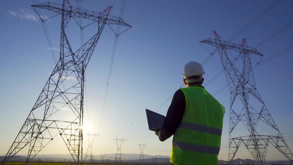 Electrical engineer doing site survey. alt