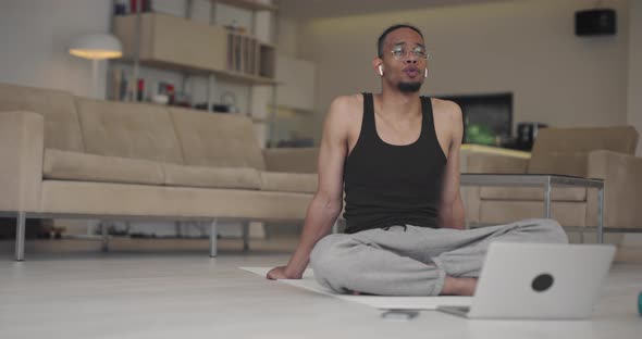 African American Fitness Trainer Using Laptop for Online Training with Client During Coronavirus alt