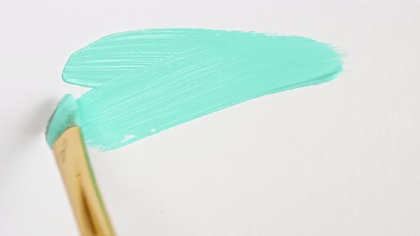 Abstract Brushstrokes of Turquoise Paint Brush Applied Isolated on a White Background alt
