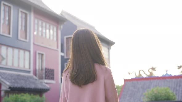 Asian tourist woman feeling happy traveling in Beijing, blogger female walking at Chinatown. alt