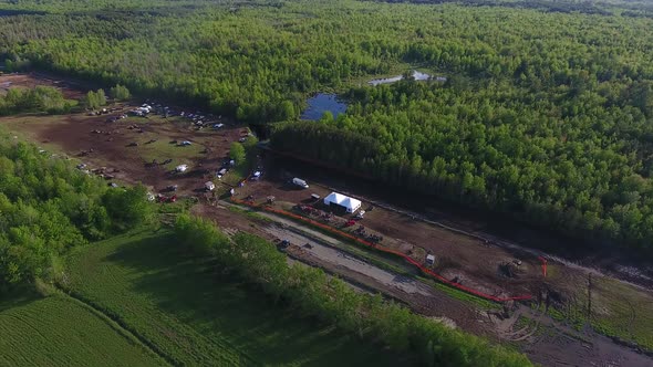 aerial mud bog festival grounds side strafe view 4k alt