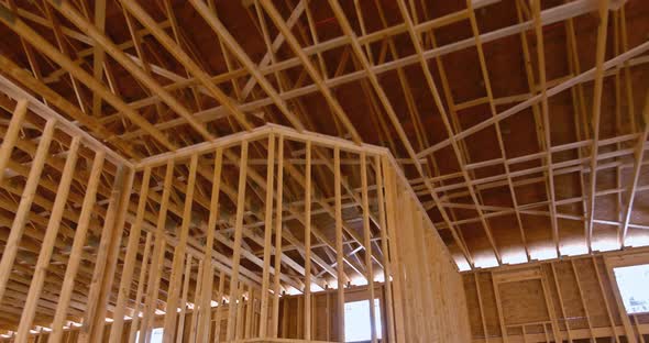 New Build Roof with Wooden Truss Post and Beam Framework Roof on Stick Built Home Under Construction alt