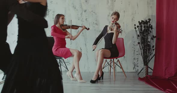 Beautiful View of Dancers Couple Perform Tango While Girls Play the Violin alt