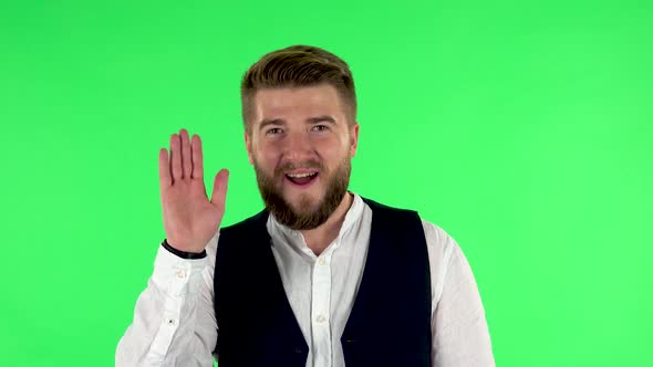 Man Waving Hand and Showing Gesture Come Here. Green Screen alt