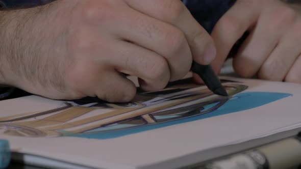 Artist hand drawing with a marker alt