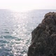 Big Rocky Boulder in the Wavy Sea on a Sunny Day - VideoHive Item for Sale