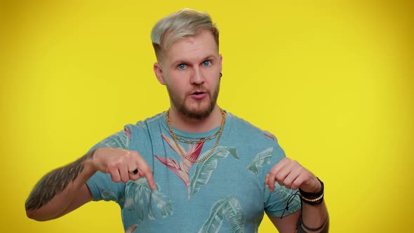 Tourist Man Pointing Down Saying to Subscribe Gesturing Ok and Like Showing Place for Commercial alt