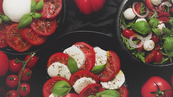 Salads with Traditional Italian Burrata and Mozzarella Cheese with Arugula and Tomatoes