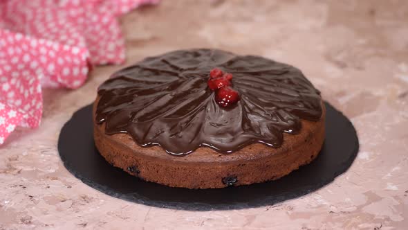 The Process of Making a Chocolate Cake with Cherries