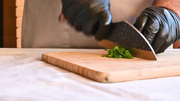 Chef Chopping Fresh Parsley with a Knife Slow Motion