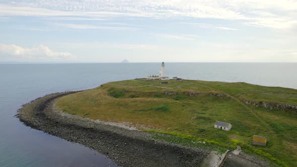 The Island of Pladda off the South Coast of Arran in Scotland with a Lighthouse alt