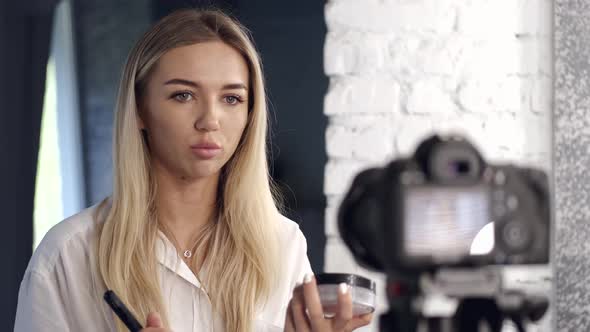 A Beautiful Makeup Artist Is Filming a Beauty Vlog in a Salon alt