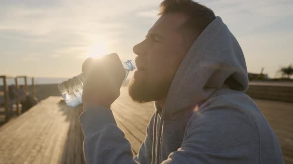 Man Getting Thirsty After Workout alt