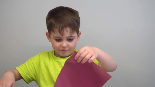 a Little Boy Cut a Beard Out of Colored Paper and Have Fun