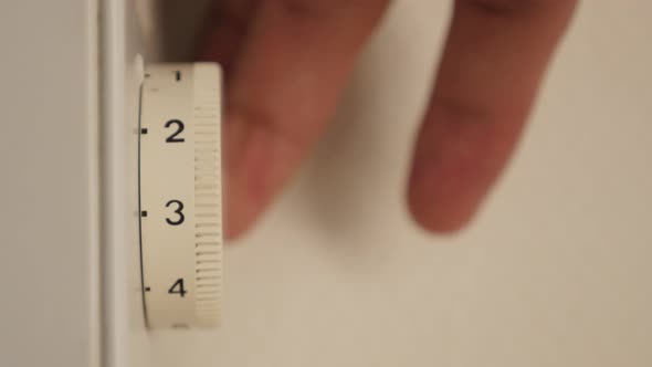 Convector heater temperature adjust on dial 4K 2160p 30fps UltraHD footage - Adjusting thermostat le alt