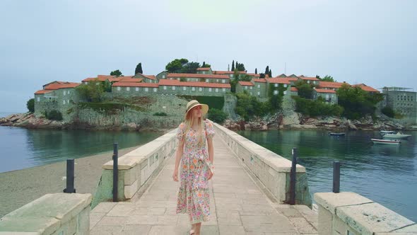Vacations in Amazing Place Cheerful Blonde Lady Walking on the Bridge