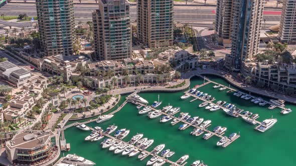Dubai Marina Harbor with Modern Yachts Aerial Timelapse alt