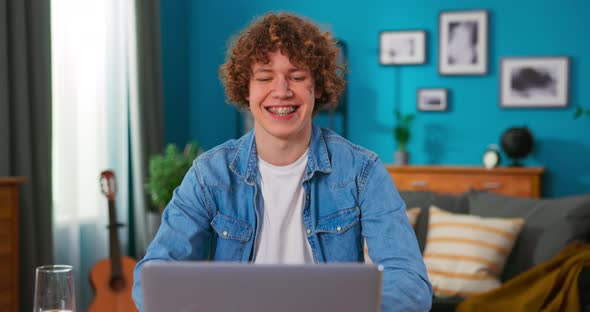 Young Boy Scream with Joy Dance Moves Feels Overjoyed When Received Email with Great News alt