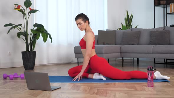 Fit Woman Doing Warmup Stretching Exercise Training on Yoga or Fitness Mat alt