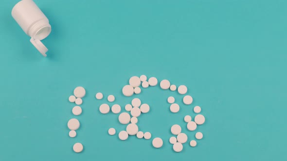 4K Stop motion animation of white pill on blue background