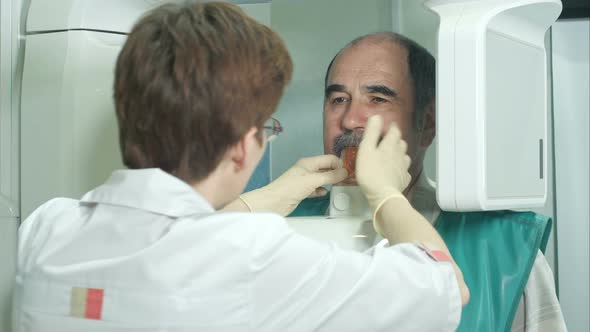 Examination of the Patient By Using Panoramic and Cephalometric X-Ray Scanner alt