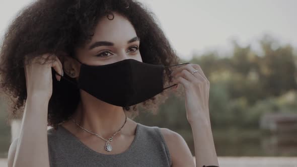 Mixed Race African American Teenager Teen Girl Young Woman Wearing a Face Mask Outside During the alt