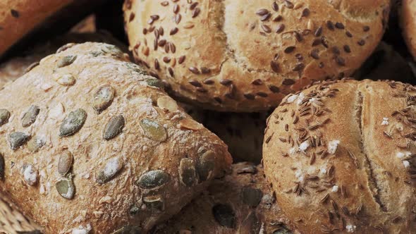 Wicker basket with selection of breads and pastries. Assortment of baked products 