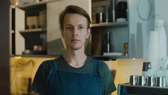 Sad coffee shop owner holding board with sign close during quarantine and lockdown alt