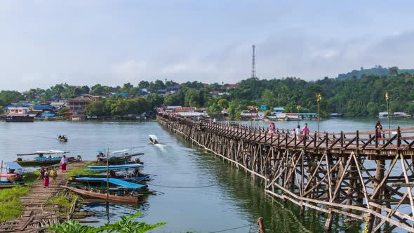 Mon Bridge, longest wooden bridge in Sangkhlaburi, Kanchanaburi, Thailand; pan right - Time Lapse