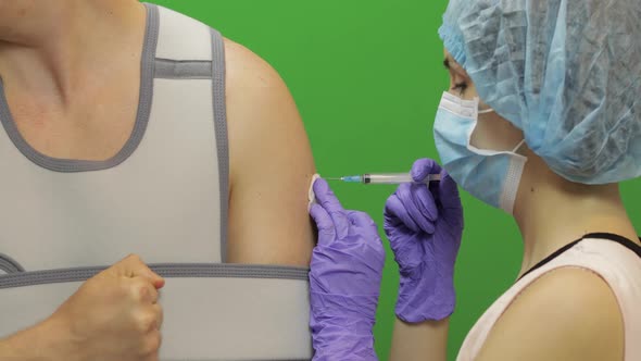 Man with Shoulder Injury. Nurse Makes Prick From Pain. Bandage Fixing Shoulder alt