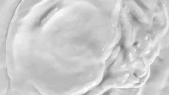Super Slow Motion Shot of Rippling Cream at 1000Fps. alt